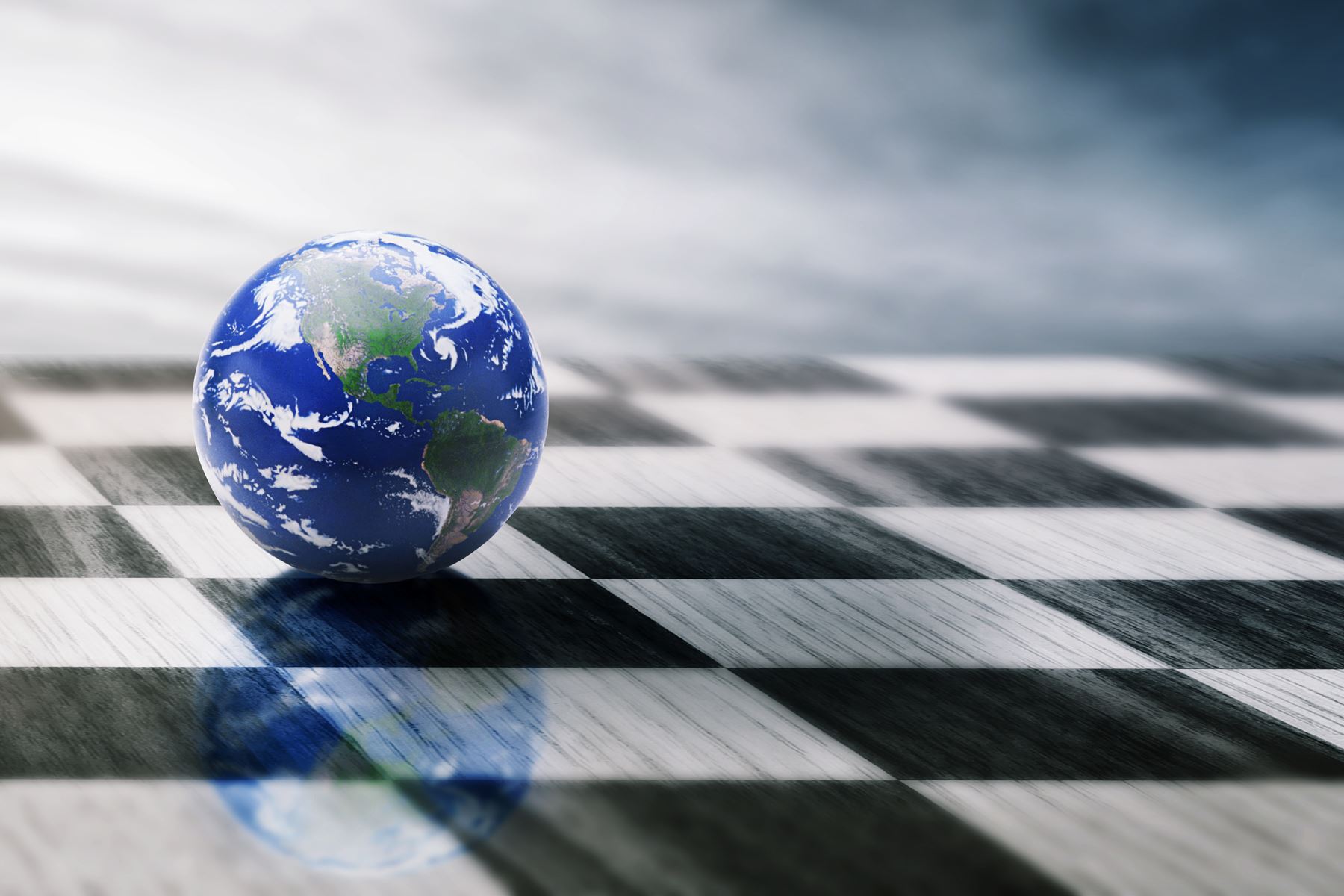 globe on a black and white chess board